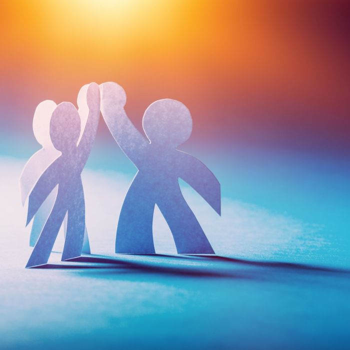 Paper People in a Circle Holding Hands