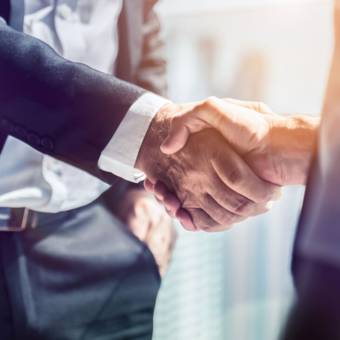 Businessman handshake for teamwork of business merger and acquis
